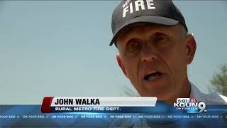 Witness recounts trying to save man who died in flooded wash