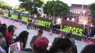 Taylor Kitsch greets fans at the Savages Premiere in West...