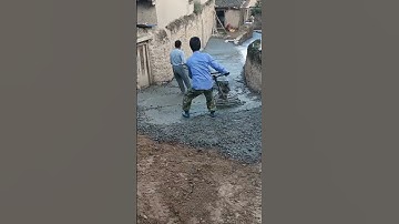 the process of leveling the cement dough when making a cast road #shorts