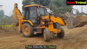 JCB 3DX Backhoe loading soil in Tractors and tipper.