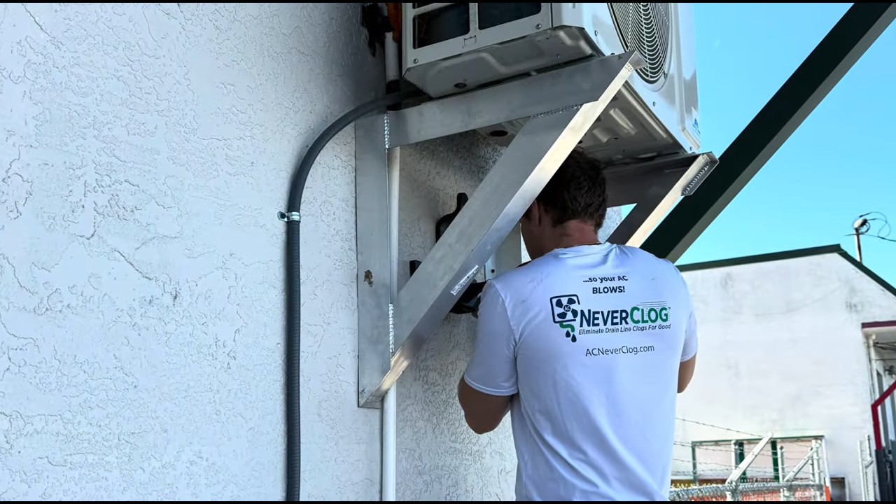 Chemical-free AC drain line maintenance system installed near air handler