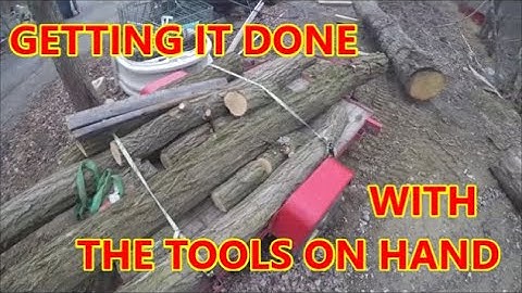 Unloading Long Locust Logs From Trailer Using Simple Hand Tools