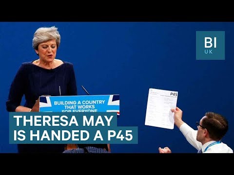 Comedian Lee Nelson hands Theresa May a P45 during conference speech