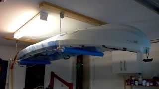 My home made kayak storage solution. Makes getting the kayak on and off the car roof racks a piece of cake. :)