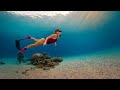 Young fit womans freediving adventure  breathtaking underwater exploration