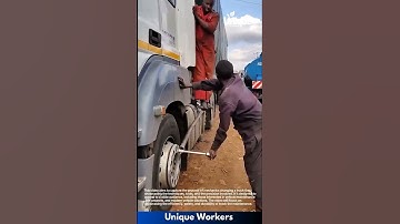 Truck tire change: professional mechanics at work