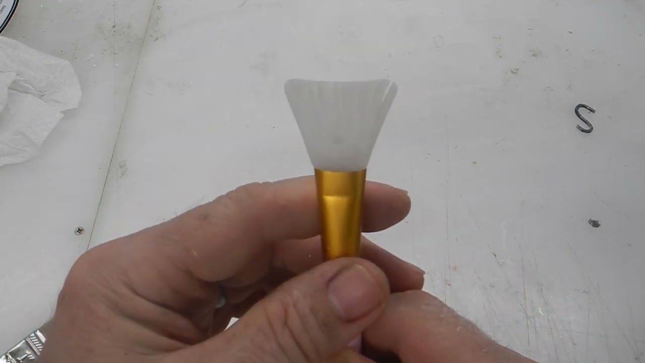 Try using silicone brushes for epoxy no more brush hairs 