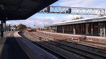 DB Class 66 66192 passes Gloucester with a rake of wagons