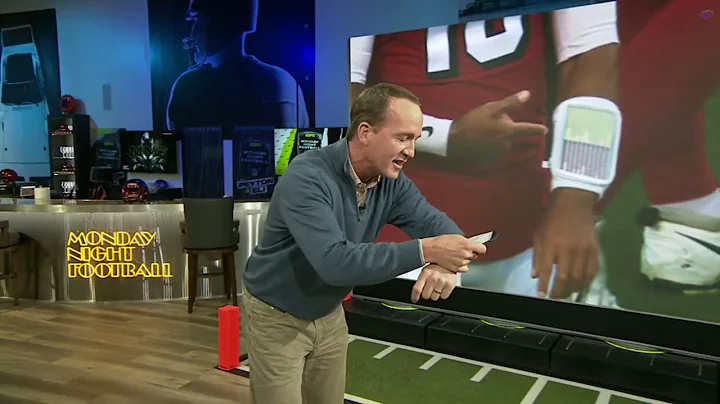 Peyton Manning gets technical (Eli's face says it ...