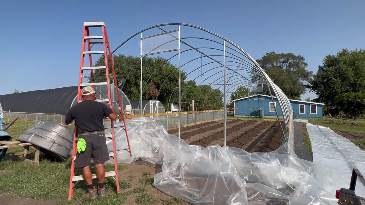 Bootstrap Farmer high tunnel build #7 — Plastic on end walls, main, and roll up sides