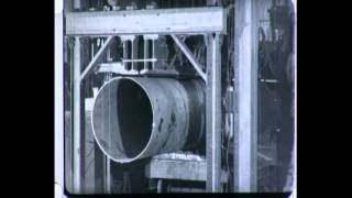 The Electric Needle - ca. 1925
Film follows the manufacture of large diameter steel water pipe at Walsh Holyoke Steam Boiler works. Shearing of 1/2 inch steel plates. Edge finishing. Rolling. Welding of pipe halves. Arc welding of seams. Fatigue, tensile and bend tests of welds. Hydraulic test of completed pipe. Dip coating. Transportation to the field. The Electric Needle - ca. 1925
