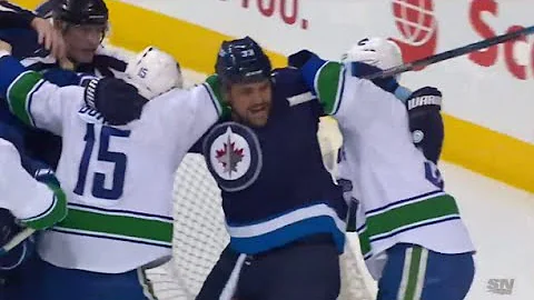 Dustin Byfuglien Takes on Two Canucks