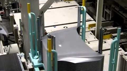 Automotive racks with columns for robotic handling of car hoods