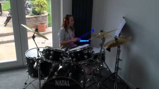 Jasmin playing drums