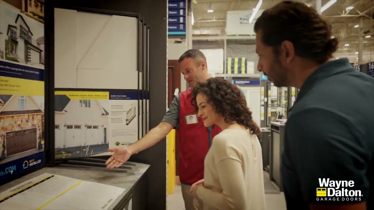 Couple discussing garage door options in Lowe's store