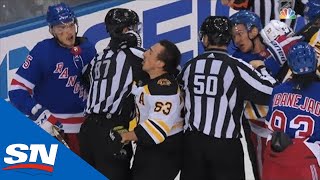 Brad Marchand Receives Helmet Popping Cross Check From Pavel Buchnevich