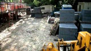 JCB loadall handler booming out blocks.