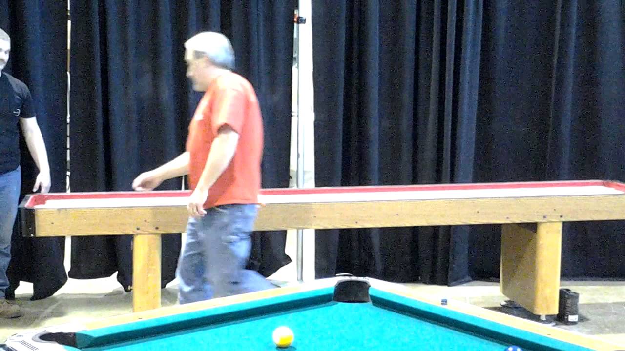 Shuffleboard Table in Action Rent a Shuffleboard Table 8887368242