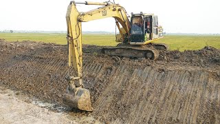 Excavator Cat 320L Are Digging Clearing Canal 