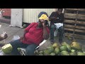 Buying a coconut in a street on Bahamas