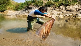 The girl found a thin skinned clam in the water, its beautiful shell filled with a lot of wealth