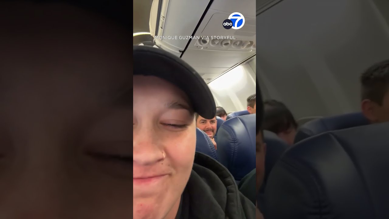 Woman Seen In Overhead Compartment On Plane