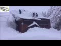 Clearing roofs in Japan's snow country