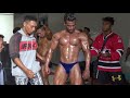 Indonesia bodybuilder backstage tanning