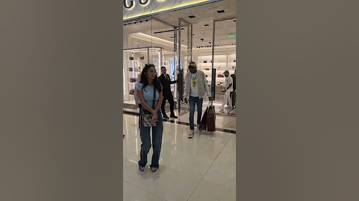 Vybz kartel caught on camera with wife coming out of Gucci store #GUCCI