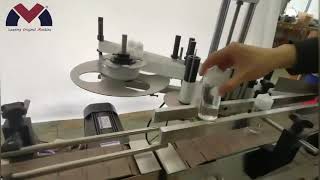 LOM table top type automatic filling capping labeling machine shipping to Spain