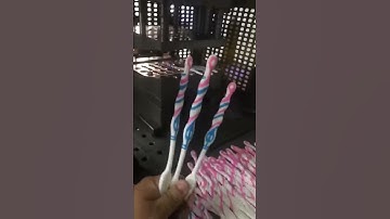 two color clear toothbrush making using vertical injection molding machine 6 cavities with rubber