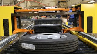 Tire Conveyor with Plastic Belt, Escapement, Pop Up Chain Transfer, and Gravity Sections