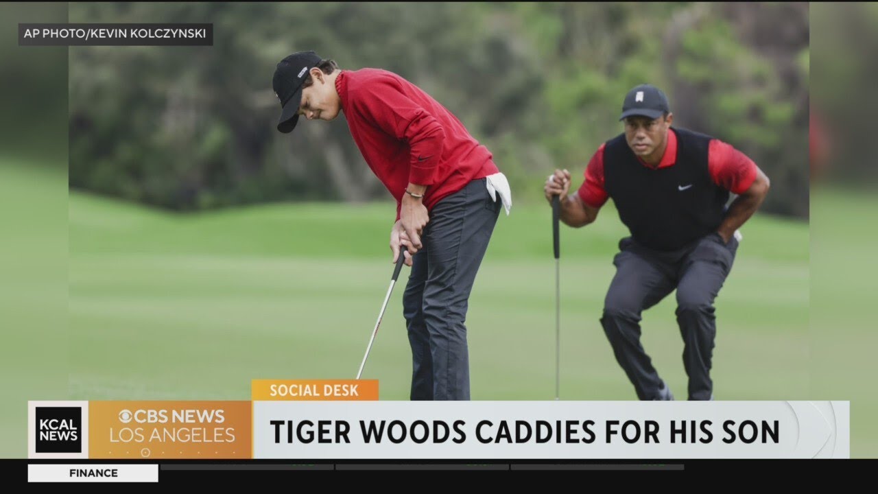 Tiger Woods caddies for his son Charlie in a recent tournament YouTube