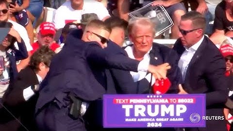 Trump rushed off stage after shots fired at rally | REUTERS
