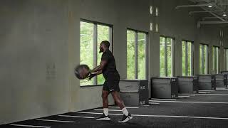 Split Stance Forward Facing Medicine Ball Hip Toss Rotating to Back Knee Exercise