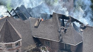 Large fire burns through castle-like home in Cottonwood Heights