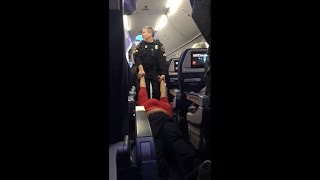 Woman dragged off Delta flight