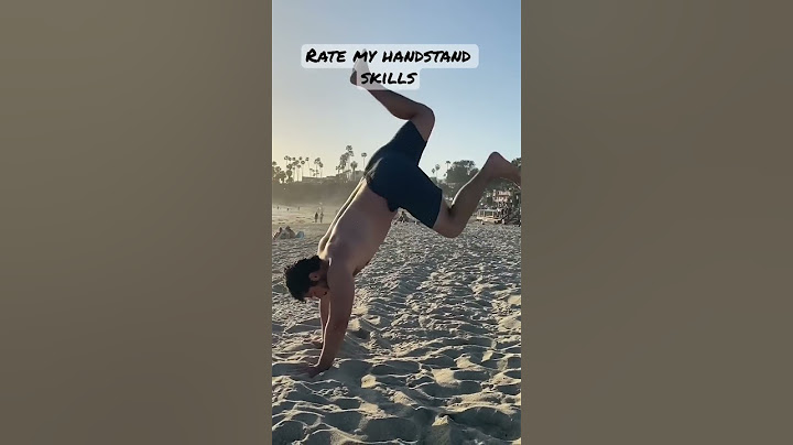 Doing handstands at the beach