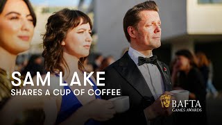 Sam Lake has a cup of coffee on the red carpet | BAFTA Games Awards 2024