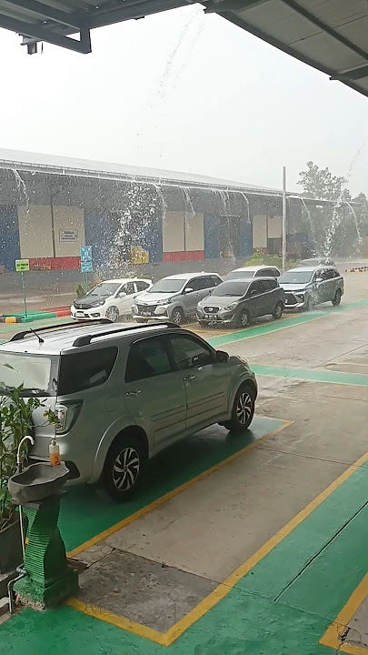 suasana hujan di depan pt enseval bangka