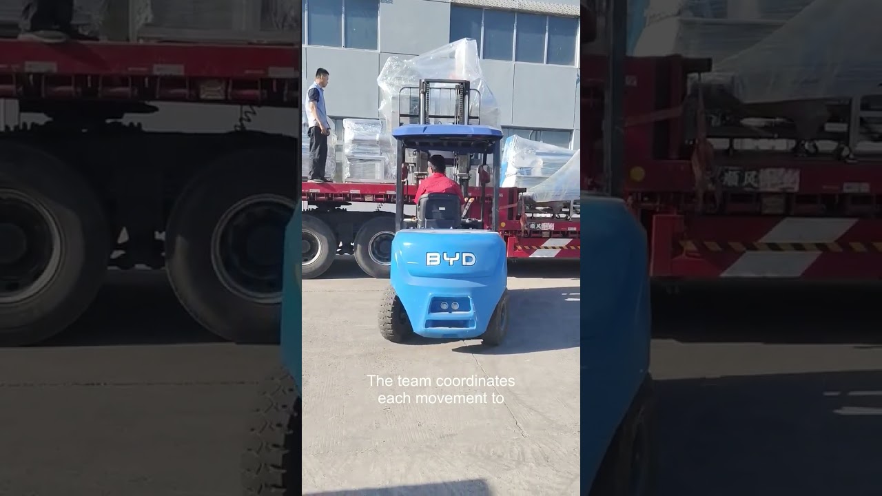Wrapped food machinery handled by forklift before truck loading