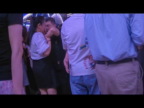 Dancing With A Beautiful Woman In The Ballroom The Dancer Is Very Gentle And The Man Is Very Happy