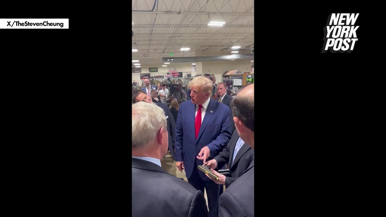 ⁣Trump ogles pistol with his face on it during South Carolina swing