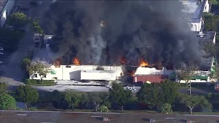 Witness describes hearing explosion before warehouse fire