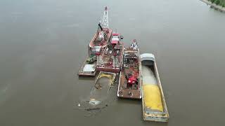 Salvaging corn from a barge that sank near Ft. Madison IA in May 2024
