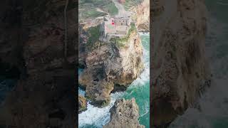 Nazaré: home of the biggest waves in the world 🌊 #portugal #surf #beach #travel #drone #lighthouse
