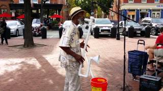 Man playing saxophone made from PVC pipe