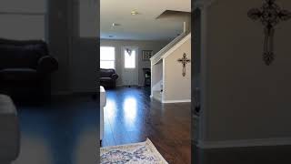 Guy scares his little boy near staircase