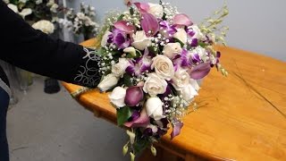 This free DIY video will demonstrate how to make a cascading floral wedding bridal bouquet with mini calla lilies, roses, and 