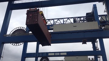 Working maneuver of a full-size container controlled via the semi-active tuned mass damper